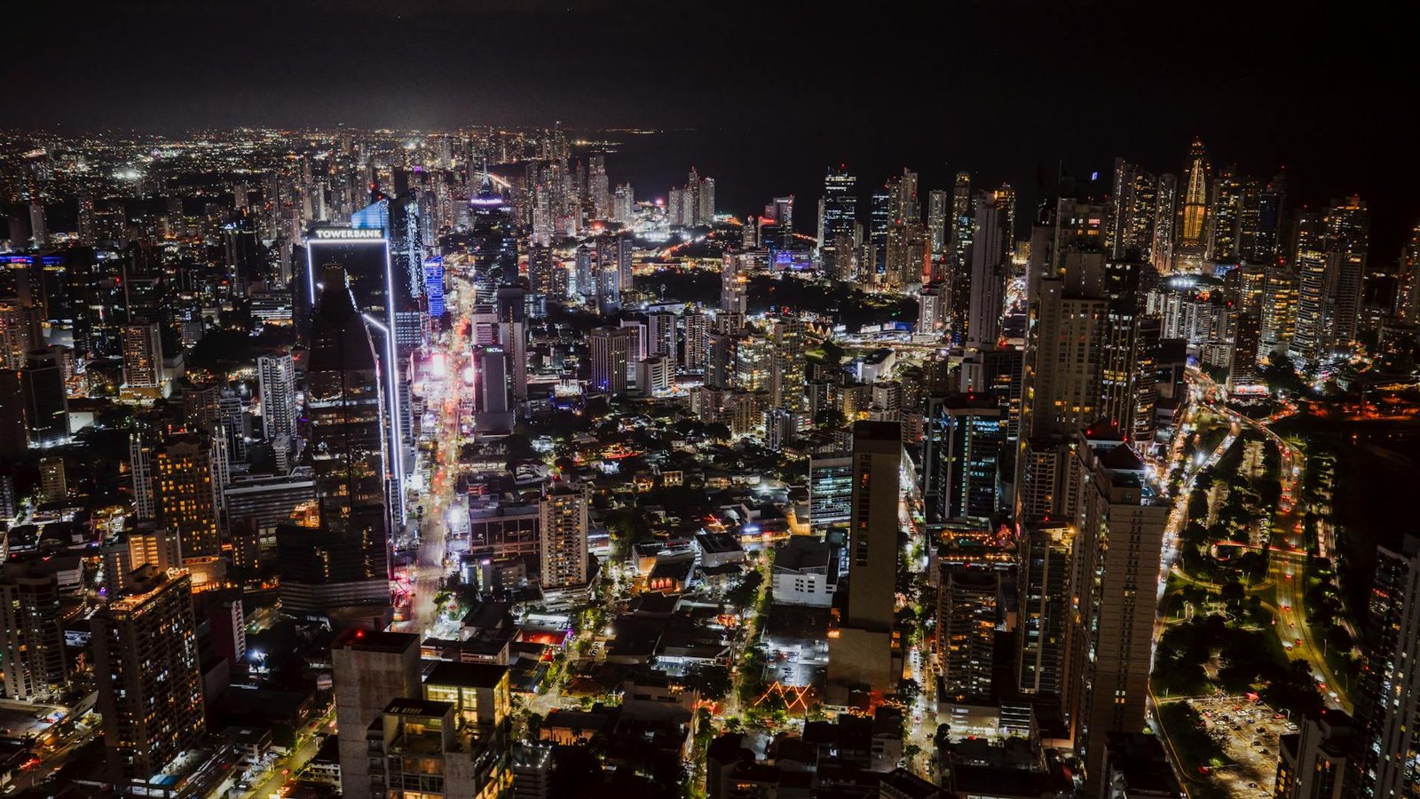 Stunning aerial shot of Panama City's illuminated skyline at night showcasing vibrant city life.