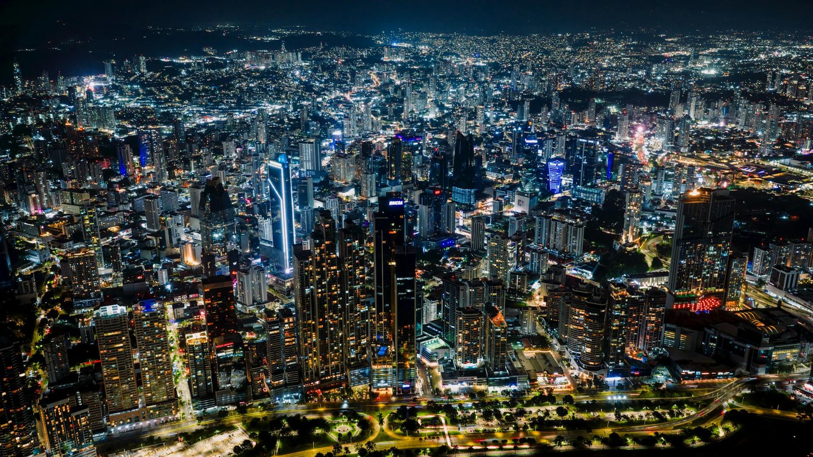 Stunning aerial shot of Panama City's vibrant skyline at night, a bustling urban landscape.