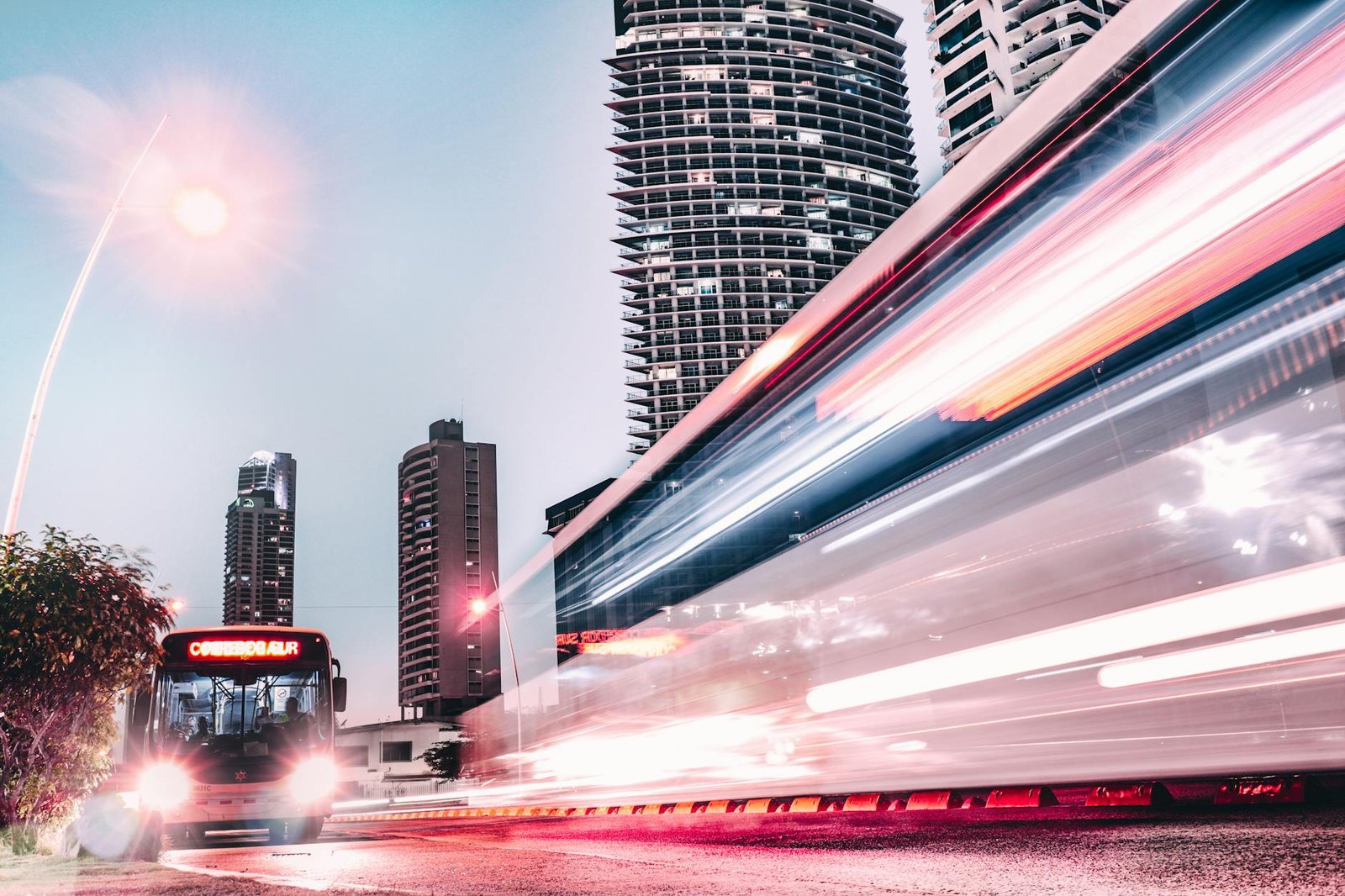 Captivating cityscape with light trails and modern architecture in Panama City captured at night.