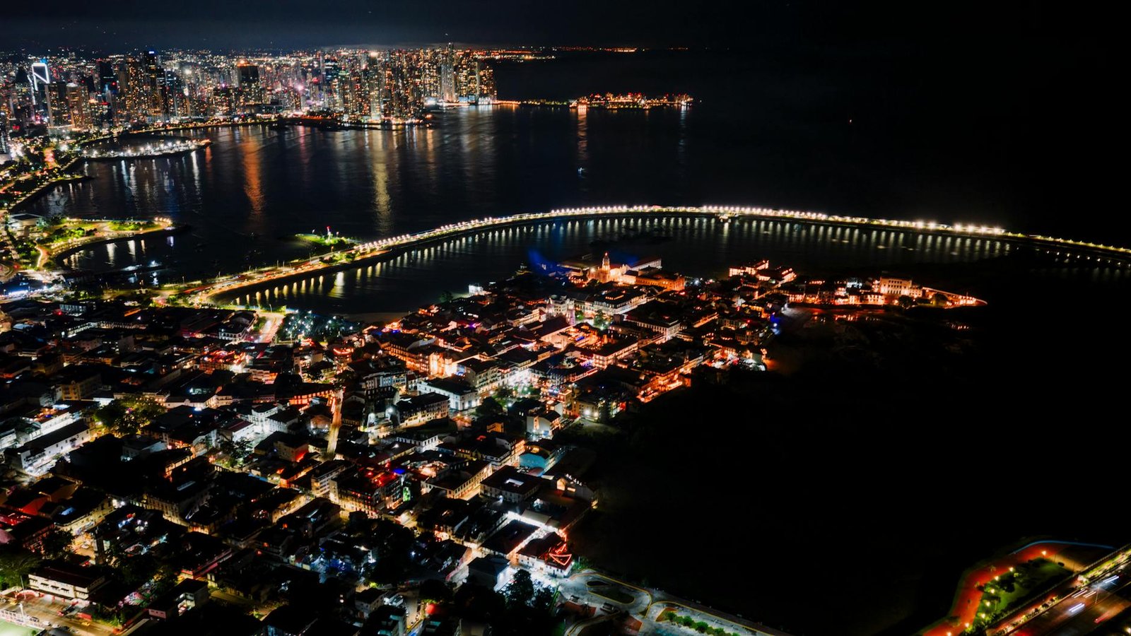 Stunning aerial view of Panama City at night showcasing its vibrant skyline and waterfront.