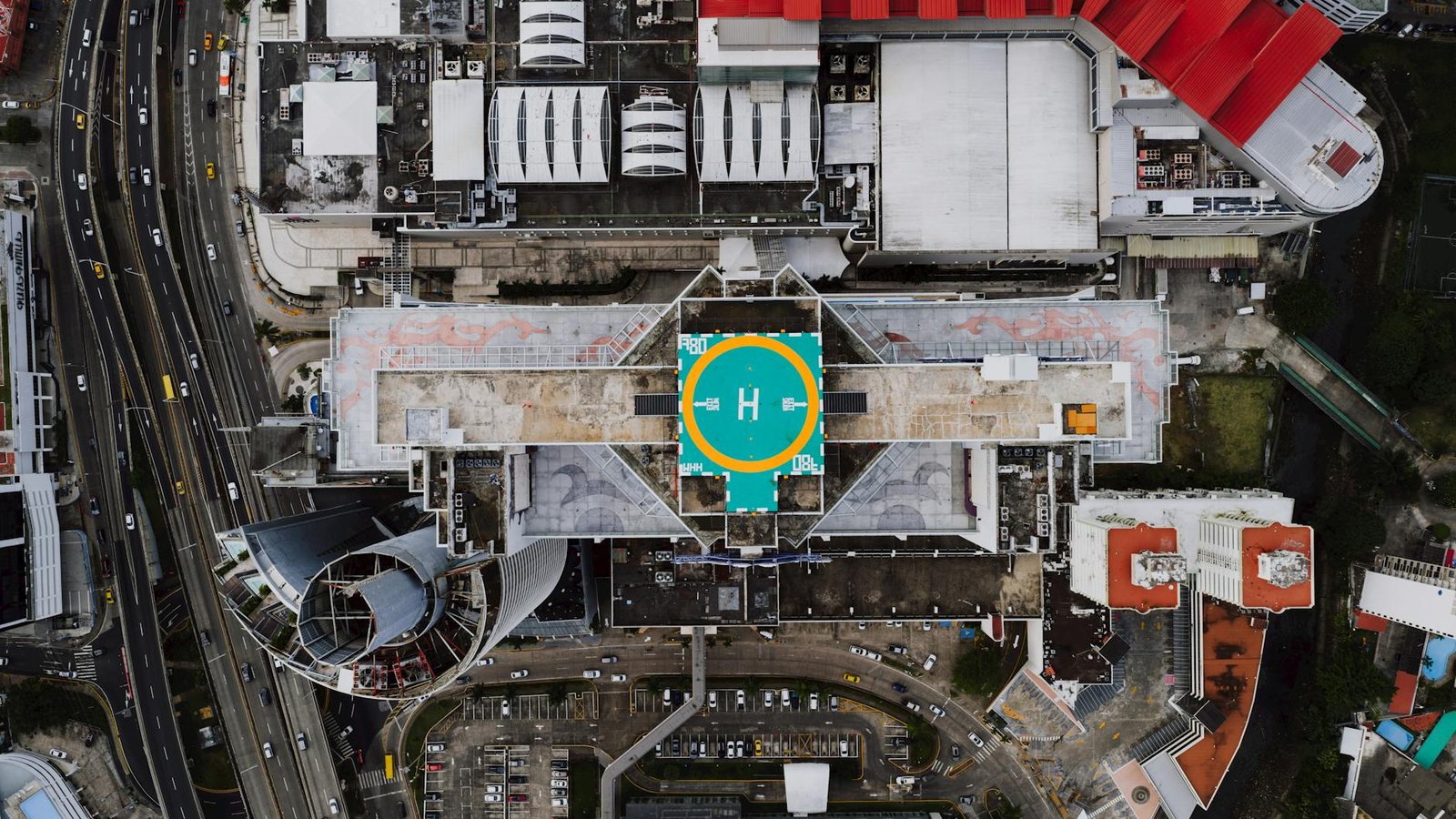 Aerial shot of urban architecture in Panama City with a prominent helipad.