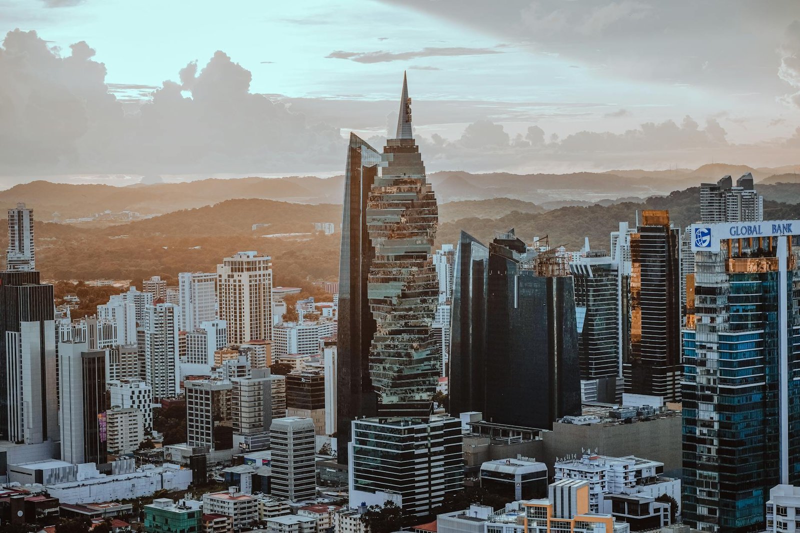 A stunning panoramic view of Panama City's skyline at sunset featuring contemporary skyscrapers.
